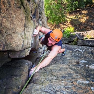 Image of Dr French rock climbing